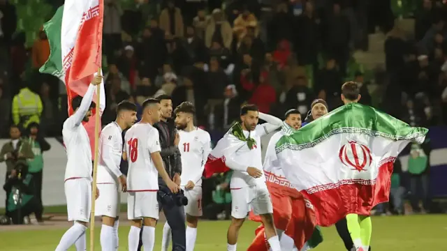 Iran national football team players celebrating goal
